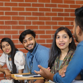Current students talking together on campus